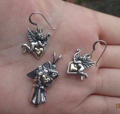 ********This sterling silver angel Earrings measure:1-1/4" from the top of the earwire to the bottom of the angel.Width of the angel at the widest part is almost 3/4" or 31mm x 18mmThe heart is gold filled.Price is for the pair of earrings at $21.95******** This Sterling Silver Angel pendant measures: just over 1-1/4"(from top of the angel to the bottom) x 5/8" at the widest part. or 33mm x 19mmThe heart is gold filled.Price is for one pendant at $18.95******************************************* Angelic Sterling Silver Jewelry For Gifts, Silver Angelic Jewelry For Gift, Angelic Silver Jewelry For Gift, Silver Pendant Earrings For Valentine's Day, Angel Earrings, Angel Pendant, What Is Advertising, Personal Checks, The Angel