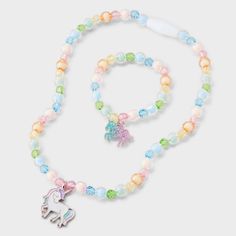 Style your little one with the Toddler Rainbow Unicorn Necklace & Bracelet from Cat & Jack™. This delightful 2-piece set includes a pull-on necklace and a snap-on bracelet, both featuring adorable unicorn charms in vibrant rainbow colors. Made from zinc alloy, acrylic and iron, this set is designed for toddlers to bring all the vibes to their outfits in an instant. Cat & Jack™: Designed for all children so you can trust it's made for yours. Glowing Necklace, Unicorn Charm, Charm Choker Necklace, Unicorn Necklace, Bff Necklaces, Choker Necklace Set, Boys Accessories, Rainbow Unicorn, Colourful Necklace