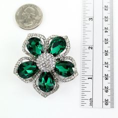 Gorgeous emerald green brooch jewelry embellishment, which can be used for your DIY project - Emerald wedding, bridal sash, cake and frame decorations, pillow and clutch decor, crafts, scrap booking and much more. Size: 1 3/4 inches wide 1 3/4 inches high Stones color: Crystal clear and emerald green Metal: Silver plated This rhinestone green broach can be ordered with pin in the back to add to wedding gown or dress sash, to wire into brooch bouquet, or any number of other craft projects; or wit Green Crystal Brooch Jewelry, Green Rhinestone Wedding Brooch, Green Rhinestone Wedding Brooches, Formal Green Rhinestone Brooches, Elegant Green Rhinestone Brooches, Green Wedding Brooches, Women Green Dress, Wedding Brooches, Green Brooch