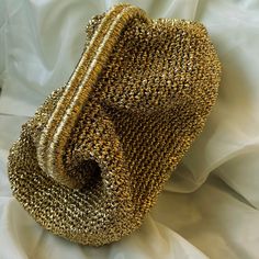 💥Introducing our exquisite Gold Clutch Tote, a stunning accessory that will elevate your evening ensemble to new heights. This Shiny Evening Pouch is designed with the finest luxury metalic material, exuding an air of elegance and sophistication. The intricate crochet detailing adds a touch of artistry, making this Metallic Clutch Bag a true statement piece for any summer occasion or wedding. 💝Handmade with love, this versatile bag can be used as a Bridesmaid Tote Bag or a Gift For Lover, maki Handmade Glamorous Evening Bag For Wedding, Luxury Gold Evening Bag With Handwork, Glamorous Handmade Wedding Bag, Glamorous Handmade Wedding Bags, Elegant Gold Bag With Handwork, Gold Handheld Clutch For Festive Occasions, Gold Handheld Evening Bag For Festive Occasions, Gold Evening Bag For Formal Festivals, Elegant Handheld Evening Bag For Celebration