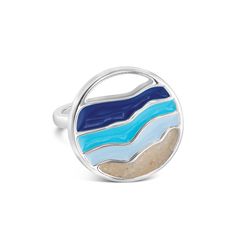 Make a splash with the Hues of Blue Cocktail Ring. The ocean's vibrant movement unfolds across your finger with mesmerizing swirls of turquoise, sapphire, and cerulean. Each ring holds a unique treasure - your chosen sand or earth element, a tangible reminder of moments spent under the sky or beside the sea. Let your adventures and dreams sparkle on every occasion. .925 Sterling Silver Hues of Blue Enamel Available in whole sizes 7, 8 & 9 Handmade with Love & Sandy Hands in the USA® Main photo shown is handmade with beach sand from St. Pete Beach, Florida Blue Polished Enamel Ring, Blue Enamel Polished Round Ring, Blue Enamel Ring With Polished Finish, Blue Enamel Ring With Polished Finish As Gift, Blue Enamel Ring With Polished Finish For Gift, Elegant Blue Enamel Ring, Elegant Blue Enamel Sterling Silver Ring, Elegant Blue Enamel Ring In Sterling Silver, Blue Rings With Polished Finish