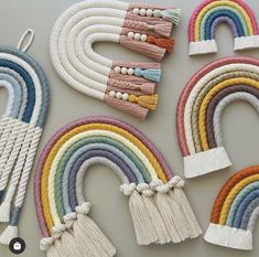 several different colors of rope with tassels attached to each one on a table