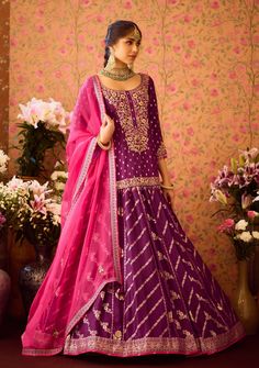 Step into refined elegance with the phlox purple hand-embroidered silk brocade kurta, beautifully paired with a multi-panel brocade lehenga. This stunning ensemble features intricate embroidery that elevates the luxurious fabric, while the lehenga offers graceful movement and flair. Complemented by an embroidered dupatta, this outfit is perfect for festive occasions and celebrations, showcasing a harmonious blend of tradition and style. Festive Purple Palazzo Set With Intricate Embroidery, Festive Purple Embroidered Palazzo Set, Semi-stitched Purple Palazzo Set With Intricate Embroidery, Purple Bollywood Palazzo Set With Resham Embroidery, Bollywood Purple Palazzo Set With Resham Embroidery, Bollywood Style Purple Palazzo Set With Intricate Embroidery, Bollywood Style Purple Embroidered Palazzo Set, Festive Purple Sets With Intricate Embroidery, Festive Purple Set With Intricate Embroidery