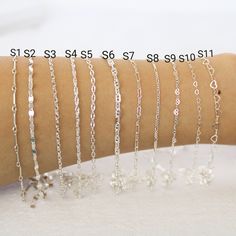 Sterling silver chain in a variety of styles.  Perfect for permanent jewelry.  Premium quality. Shiny and strong.  Cut to size and I will send one continuous length of chain. Sample Pack: you get one inch of chain per style.  S1: Bar Link Chain (works with 22 gauge or thinner jump rings)       width: 0.9mm       loop inside diameter: 0.76mm        bar length: 12.7mm  S2: Flat Disc Chain (works with 22 gauge or thinner jump rings)         width: 2.5mm        link length: 3.56mm S3: Diamond Cut Ov Silver Cable Chain For Jewelry Making, Silver Cable Chain Bracelet As A Gift, Silver Bracelets With Delicate Oval Link Chain, Silver Link Bracelet With Delicate Chain, Silver Jewelry With Delicate Oval Link Chain, Silver Dainty Chain Link Bracelet, Silver Dainty Oval Link Chain Bracelet, Silver Chain Necklace With Delicate Oval Link, Adjustable Silver Cable Chain Bracelet