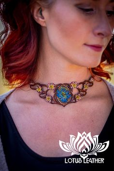 Step into a realm of enchantment with our fae-style natural leather vine and flower choker. Crafted for those who carry the heart of a faery queen, this exquisite piece captures the essence of the cottagecore aesthetic. It's more than a leather choker necklace; it's a handmade emblem of nature's untouched beauty. Perfect for forest wanderings or as a magical accent to your daily look. 🌿✨ Save this piece of the forest for your jewelry collection! #Cottagecore, #HandmadeJewelry, #NatureInspired Handmade Fantasy Choker For Festivals, Handmade Fantasy Festival Choker, Whimsical Adjustable Choker, Adjustable Whimsical Choker, Handmade Whimsical Choker Jewelry, Fantasy Festival Choker Jewelry, Bohemian Brown Flower Necklace, Nature-inspired Brown Flower-shaped Jewelry, Fantasy Style Adjustable Choker Jewelry