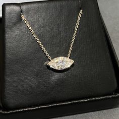 Moissanite offers timeless beauty and exceptional value. This beautiful pendant and chain set features a GRA certified VVS1 clarity D color Moissanite hand set by our master jewelers on a durable 14K gold setting. The mesmerizing stone is a generous 12MM x 6MM size. This is the best compromise between cheap fakes (CZ, crystal, rhinestone) and an extremely expensive diamond. Natural diamond equivalent stones cost $10,000 - $100,000+. Get the same look at a reasonable price. Necklace can be worn a Marquise Pendant Necklace, Diamond White Moissanite Marquise Cut Jewelry, Platinum Marquise Necklace For Anniversary, Anniversary Moissanite Necklace With Vs Clarity, Silver Marquise Necklace With Prong Setting, Marquise Diamond Solitaire Necklace For Formal Occasions, Marquise Diamond Necklace In Sterling Silver For Formal Occasions, Marquise Sterling Silver Diamond Necklace For Formal Occasions, Silver Diamond Necklace With Marquise Prong Setting