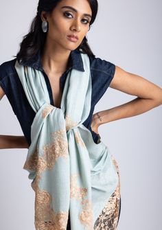 Woven from a fine cashmere, this azure scarf features an exotic dual shade beige - copper chantilly lace application extending at the ends of the scarf. A unique and stunning evening wear accessory to elevate the look of any outfit. Elegant Dupatta Scarf, Luxury Pashmina Shawl Scarf, Elegant Blue Pashmina Shawl, Elegant Pashmina Dupatta Style Scarf, Elegant Pashmina Scarf In Traditional Drape, Elegant Pashmina Scarves In Traditional Drape, Elegant Blue Pashmina Shawl For Festivals, Elegant Blue Shawl With Dupatta, Elegant Blue Shawl For Festive Occasions