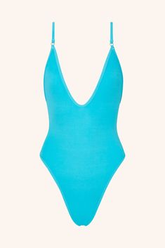 It’s our most iconic one-piece swimsuit. Whether you’re making waves or catching them, this plunging neckline one-piece in Aquamarine delivers confidence with every splash. It’s more than swimwear – it’s a fashion statement. Cut & Fit Shaping, sculpting fit Pulls on Plunging neckline High-cut style with medium coverage brief Hardware & Straps All gold hardware Adjustable shoulders straps Lining & Fabric Double-lined  84% polyamide, 16% elastane Model Measurements: Height 176 cm | Bus Royal Blue Swimsuit, Gold One Piece, Swimwear Design, Brown One Piece, Grey One Piece, Gooseberry Intimates, Green One Piece Swimsuit, Green One Piece, Red One Piece