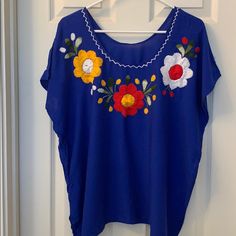 Gorgeous And Vibrant Blouse With Beautiful Stitching And Flower Detail. Nwot Blue Floral Embroidery Blouse For Summer, Blue Floral Embroidered Summer Blouse, Blue Floral Embroidery Top For Vacation, Blue Floral Embroidery Beach Tops, Bohemian Short Sleeve Blue Blouse, Bohemian Blue Short Sleeve Blouse, Embroidered Blue Blouse For Vacation, Blue Embroidered Top For Vacation, Flower Detail