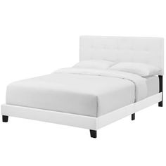 a bed with white linens and black legs on the headboard, against a white background