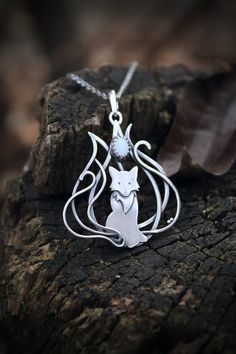 ITEM DESCRIPTION: The size of the pendant H 5 cm x W 5 cm. Weight - 5 g. You can buy it with the chain any convenient size or without. Jewelry will come to you in a gift box - ready for gift giving. This pretty Kitsune necklace was made by me of sterling silver and opal. This is a fox with nine tails - a character in Japanese mythology. These animals have great knowledge, long life, and magical abilities - perfect animal totem! The parcel will be sent during 1-2 days after payment. Delivery usua Fantasy Silver Round Pendant Necklace, Fantasy Silver Necklace With Round Pendant, Silver Round Pendant Necklace In Fantasy Style, Nature-inspired Metal Jewelry For Gifting, Nature-inspired Silver Jewelry With Adjustable Chain, Nature-inspired Metal Jewelry For Gifts, Nature-inspired Metal Jewelry For Gift, Collectible Silver Necklace Nature-inspired, Fantasy Pendant Necklace Nickel Free