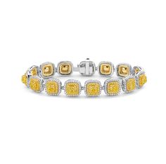 A 10 Carat diamond bracelet, consisting of Fancy Yellow cushion cut diamonds, surrounded by Intense Yellow and White Brilliant Diamonds. This was Handmade in NYC in 18K yellow and white gold. Expensive Purses, Halo Bracelet, Yellow Cushion, Halo 3, Yellow Cushions, Double Halo, Cushion Cut Diamonds, Diamond Halo, Yellow Diamond