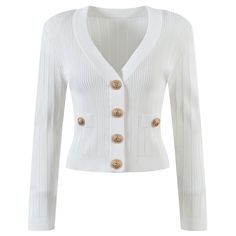 Looking for a stylish and trendy knit cardigan that you can wear all year round? Look no further than our cropped Vida V-neck knit cardigan with gold buttons, inspired by the iconic designs of Balmain. This cardigan is made using high-quality knit fabric, making it the perfect choice for anyone who wants to look their best while staying cozy and comfortable. With its chic design, this cardigan is sure to turn heads wherever you go. Pair it with jeans and white sneakers for a casual look, or make Chic V-neck Sweater With Buttons, Elegant V-neck Sweater With Buttons For Winter, Chic Gold Cardigan For Winter, White V-neck Cardigan With Buttons, Chic Gold Cardigan For Fall, Elegant Fitted White V-neck Sweater, Chic Knit Cardigan With Buttons, Elegant V-neck Sweater With Button Closure For Spring, Rib Knit Cardigan