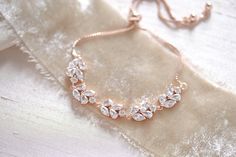 Our delicate rose gold wedding bracelet features sparkly cz stones that effortlessly add a touch of shine to any look! - Bracelet has an adjustable slide clasp that will fit most wrist sizes - Available in rose gold and rhodium (silver) finishes - Handcrafted with high quality cubic zirconia Browse My Entire Shop For More Jewelry & Accessories: https://www.etsy.com/shop/TheExquisiteBride Browse My Shop For Earrings: https://www.etsy.com/shop/TheExquisiteBride?section_id=14483895 Browse My Sh Elegant Rose Gold Bracelets For Wedding, Elegant Rose Gold Crystal Bracelet For Anniversary, Delicate Rose Gold Cubic Zirconia Bracelets, Elegant Wedding Diamond Bracelet With Adjustable Chain, Elegant Sparkling Rose Gold Bracelet, Formal Sparkling Rose Gold Bracelets, Adjustable Rose Gold Bracelets For Wedding, Delicate Rose Gold Bracelets For Party, Sparkling Rose Gold Anniversary Bracelets