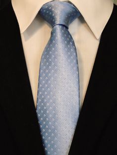 "This is a classic 100% silk light Blue Tie. This light blue necktie is also available as a extra long Tie. Handmade from 100% silk, this special collection features a .75\" Eds Neckties logo at the bottom right front corner of every tie and a larger logo located on the tipping (Back of the tie). The label features the collection name (Nathaniel Alexandria) Named after my son Nathaniel and my daughter Alexandria. Expertly hand-made from 100% silk you can select your length from 57\" to 63\" (Gre Elegant Blue Neckwear For Business, Classic Blue Ties For Business, Classic Blue Business Ties, Elegant Blue Neckwear With Ties, Classic Blue Neckwear For Black Tie Events, Blue Semi-formal Necktie, Blue Semi-formal Neckwear, Classic Blue Neckwear For Business, Classic Blue Neckwear For Semi-formal Occasions