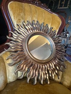 a mirror sitting on top of a yellow chair