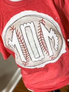 a t - shirt with an image of a baseball on it