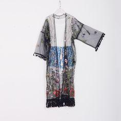 Welcome to my shop, I am in China. It will need around 30 days for international orders. Please consider the time when placing order. Long bohemian kimono,perfect for a casual day out or as a swimsuit cover up. Material: embroidery mesh fabric Size: cuff opening to cuff opening: 55 inches (140cm) cuff width: 10 inches (25cm) chest: 25.5 inches( 65cm) flat length include fringe: 49 inches (125cm) Care: Wash in cold water Hand washing recommended Gentle machine wash Hang to dry Maybe you will like Long Floral Embroidered Summer Kimono, Elegant Floral Embroidered Summer Kimono, Summer Kimono With Floral Embroidery And Kimono Sleeves, Summer Floral Embroidered Kimono With Kimono Sleeves, Spring Floral Embroidered Kimono With Kimono Sleeves, Summer Kimono With Floral Embroidery, Spring Floral Embroidery Kimono With Kimono Sleeves, Sheer Kimono With Kimono Sleeves For Summer, Long Tasseled Kimono For Spring