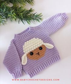 a knitted sweater with a sheep on it