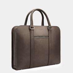 A contemporary case acting as personal portfolio; an everyday companion for the modern gentleman. Modern Rectangular Briefcase With Top Carry Handle, Modern Rectangular Briefcase With Top Handle, Modern Briefcase With Top Carry Handle, Luxury Office Briefcase With Top Carry Handle, Minimalist Workwear Briefcase, Modern Office Satchel With Laptop Sleeve, Timeless Briefcase For Business Trips With Top Carry Handle, Sleek Rectangular Briefcase For Formal Use, Sleek Rectangular Briefcase For Work