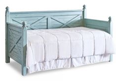 a bed with a wooden headboard and foot board