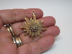 Wonderful Antique 14K Gold fine jewelry~ Pendant Charm & brooch~ Lavalier Bright Gold with several set pearls ~ Sunburst~ Starburst shape  Jewelry that can be worn as a brooch or as a pendant There is a articulating bale in the back to switch back and forth between a brooch and pendant. Victorian~ Edwardian pin brooch  Circa 1920  Comes with a nice velvet case Stamp 14k  Nice high quality solid gold  color Piece of collection ! In good condition~ See photos  Size: 1 1\2 inch x 1 1\4 inch  Size: Bright Gold, Jewelry Pendant, Gold Charm, Lapel Pin, Pin Brooch, Favorite Things Gift, Pendant Jewelry, Antique Jewelry, Solid Gold