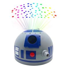 a light up r2d2 speaker with stars on it's head and lights coming out