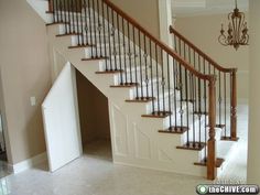 the stairs in this house are made of wood and wrought iron