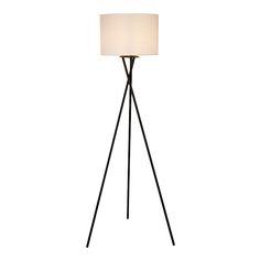 the tripod floor lamp has a white shade on it's top and black legs