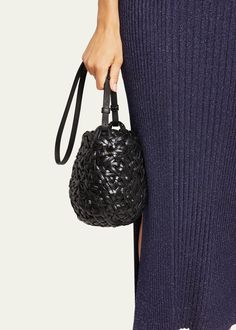 "Find LOEWE Nest Small Basket Bucket Bag on Editorialist. The Loewe \"Nest\" bucket bag is crafted from woven leather and features an adjustable shoulder strap and an open top. It measures approximately 7.4\"H x 7.4\"W x 6.6\"D. This bag is made in Spain." Luxury Black Woven Leather Bucket Bag, Woven Leather Bucket Bag For On-the-go, On-the-go Woven Leather Bucket Bag, Basket-shaped Bucket Bag With Woven Leather For Shopping, Basket-shaped Woven Leather Bucket Bag For Shopping, Bucket Bags, Small Basket, Leather Bucket, Leather Bucket Bag