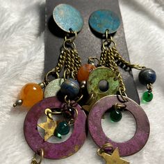 Handcrafted, Boho Earrings, Noc, Metal Circles, And Disc Stars Glass Bead, Stone Bead Connected With Gold Chain. 58 Multicolor Metal Dangle Chandelier Earrings, Handmade Purple Metal Earrings, Nickel Free Purple Earrings For Festival, Nickel-free Purple Earrings For Festival, Purple Drop Earrings For Festival, Bohemian Purple Chandelier Earrings With Ear Wire, Unique Purple Earrings With Dangling Beads, Purple Metal Dangle Chandelier Earrings, Purple Metal Dangle Earrings