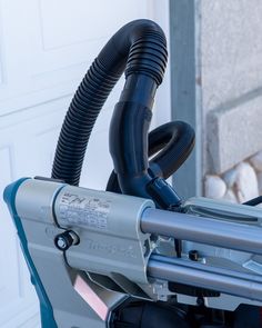 a close up view of the handlebars on a motorcycle with a hose attached to it