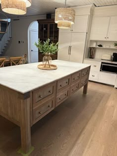 a large kitchen island in the middle of a room