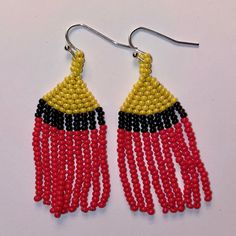 These beaded earrings will bring a pop or color to any outfit. They are hand woven with three colors throughout. Due to the light weight, this move with your movement (without a tickle). Adjustable Red Handwoven Earrings, Festival Handwoven Adjustable Beaded Earrings, Adjustable Handwoven Beaded Earrings For Festivals, Woven Red Jewelry For Summer, Red Woven Jewelry For Summer, Adjustable Multicolor Woven Beaded Earrings, Multicolor Woven Adjustable Beaded Earrings, Adjustable Multicolor Handwoven Beaded Earrings, Adjustable Handwoven Beaded Drop Earrings