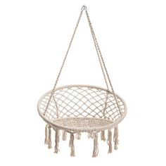 a white hanging chair with tassels