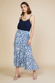 This floral-print wrap skirt is ready for days in the sun. It ties at the side waist and falls to a flowy, shin-grazing hem. The elasticized back waistband ensures a comfortable fit. •Wrap style •Tie at side waist •Elasticized back waistband Item Number: 52745 Blue Printed Skirt Outfit, Ruffled Wrap Skirt, Blue Printed Skirt, Printed Skirt Outfit, Ruffle Wrap Skirt, Lace Trim Cami Top, Lace Trim Cami, Printed Skirt, Skirt Outfit