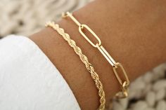 This 3 mm Gold Rope Bracelet is expertly crafted and diamond cut to catch the light at every angle.  A beautiful and affordable alternative to solid gold. 18k Gold filled laminate is an excellent option for long-lasting pieces. High quality guaranteed (NO TARNISH) Please note: this listing is for one bracelet only   18K GOLD-FILLED?   18k gold-filled jewelry is created with a thick layer of 18k solid gold over a metal core. Gold-filled jewelry is a beautiful, and affordable alternative to solid Everyday Diamond Cut Chain Bracelet, Dainty Gold Bracelet With Diamond Cut For Everyday, Dainty Everyday Diamond Cut Bracelets, Adjustable Gold Chain Bracelet With Diamond Cut, Adjustable Gold Diamond Cut Chain Bracelet, Minimalist Diamond Cut Bracelet For Everyday Wear, Dainty Gold Bracelets With Diamond Cut, Gold Rope Bracelet, Black Tourmaline Necklace