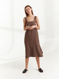 "ELLIDY is a simple strap linen dress with belt. DETAILS - Sleeveless design - Spaghetti straps - Self-tie belt - 100% lightweight European linen fabric - Cut and sewn to order just for you in our studio COLOR - Cocoa, you can also choose other colors above - Fabric samples are available here https://www.etsy.com/listing/586569696/linen-fabric-samples SIZING & FIT - True to size - Model is 5'8.9\" / 175cm and wearing a size S CARE FOR LINEN - Machine wash up to 30ºC/86ºF gentle cycle - Lay f Summer Brown Linen Daywear Dress, Chic Linen Sundress With Adjustable Straps, Linen Square Neck Dress With Adjustable Straps, Elegant Linen Midi Dress With Adjustable Straps, Linen Dress With Adjustable Straps And Square Neck, Chic Linen Midi Dress With Tie Straps, Sleeveless Linen Dress With Adjustable Straps For Brunch, Square Neck Linen Dress With Adjustable Straps, Linen Midi Dress With Adjustable Straps