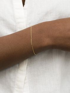 A dainty cable chain bracelet is a delicate and simple piece of jewelry that is perfect for both casual and formal wear - a classic accessory for those who appreciate minimal elegance. This delicate bracelet features a slender cable chain that drapes gracefully around your wrist, adding a touch of understated glamour to any outfit. The dainty design is versatile, allowing you to wear it alone for a timeless and classic statement, or customize it by adding your favorite charms to create a unique Luxury Adjustable Delicate Chain Bracelet, Permanent Bracelet, Minimal Bracelet, Understated Glamour, Permanent Jewelry, Gold Bracelet Chain, Jewelry Cleaner, Exquisite Jewelry, Cable Chain