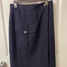 This Is A Navy Blue Cargo Pocket Wrap Utility Skirt In Size Small From Banana Republic. No Flaws. Size Small, Fits 4-6. Button At Each End Of Waist, For A True Wrap. Fully Lined. Blue Office Skirt With Pockets, Navy Knee-length Bottoms With Pockets, Fitted Blue Pencil Skirt With Pockets, Navy Work Skirt With Pockets, Navy Workwear Skirt With Pockets, Utility Skirt, Blue Banana, Banana Republic Skirt, Cargo Pocket