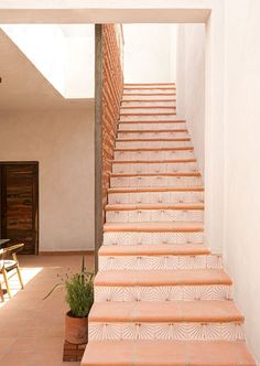 a set of stairs leading up to an open door