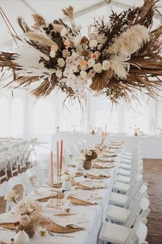 Marquee wedding venue with light wooden floors, white walls, hanging rustic floral installation and white table covers with blush candles. Farmhouse Wedding Dress, Boho Farmhouse Wedding, Spain Ranch, Farmhouse Wedding Venue, Modern Boho Farmhouse, Rue De Seine Wedding Dress, City Farmhouse, Barn Wedding Reception, Barn Wedding Decorations