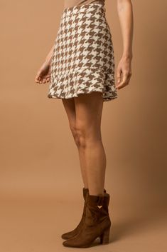 This skirt is absolutely adorable and such a statement for fall/winter! Houndstooth is such a trend right now and we are here for it. This skirt also has a friend...check out the matching jacket that you could pair with it! Trendy Lined Mini Skirt For Fall, Fall Mini Lined Skirt, Trendy Fall Mini Skirt For Day Out, Trendy Brown Fall Mini Skirt, Trendy Mini Skirt For Fall Day Out, Trendy Mini Skirt For Fall, Trendy Brown Mini Skirt For Fall, Houndstooth Mini Skirt For Fall, Fall Day Out Pleated Mini Skirt