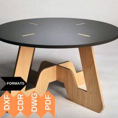 a black table with wooden legs and an orange arrow