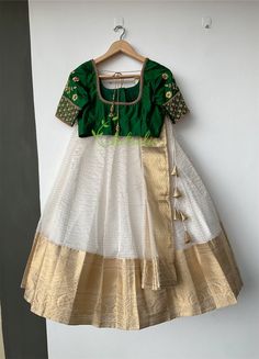 Fashion continues to change and make your own style statement. Please do send us messages regarding your dream wedding outfit. Green silk blouse with floral motif and Kali work go with an organza Lehenga which have a gold Jerry boarder. A matching dupatta and a waist belt comes with this.  It's inside is completely finished with soft cotton fabric. Size and color of blouse can be customise according to your needs. We need 10 days production time and 7 days shipping time. Green Silk Blouse, Gold Organza, Blouse Indian, Organza Lehenga, Indian Blouse, Etsy Wedding Dress, Indian Wedding Dress, Bottle Green, Green Silk