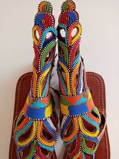 Unique Gift | Sandals | Gladiator Sandals | Greek Sandals | Beach Jewelry | Wedding Shoes | Leather Sandals | Custom | Mothers GiftAn elegant and authentic pair of African inspired beaded ladies sandals, with a unique and eye-catching design. 100% genuine leather. *100% genuine leather.Main Color - Multicolored. ✂⋯⋯ S I Z E  C H A R T ⋯⋯✂EU.........USA........UK.........CM............INCHES34..........3.5...........1.5.........22.3...........8.835..........4.5...........2.5........23............ Traditional Multicolor Ankle Strap Sandals, Traditional Multicolor Sandals With Round Toe, Traditional Multicolor Toe Post Sandals, Traditional Multicolor Sandals For Festivals, Traditional Multicolor Leather Sandals, Traditional Handmade Multicolor Huarache Sandals, Artisan Multicolor Sandals For Festivals, Handmade Traditional Ankle Strap Sandals, Multicolor Round Toe Sandals For Festivals