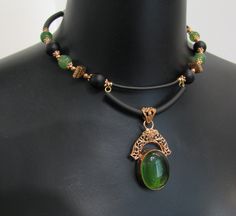 Vintage style copper lace pendant necklace and earring set/green jade and copper jewelry set/vintage copper pendant set memory wire choker/gift for her designer necklace/ooak Handmade jewelry set Necklace with pendant and earrings Copper lace pendant with green quartz and necklace on memory wire with green jade beads, black agate beads, artisan copper beads, copper color metal beads and silicone cord. Lightweight, not heavy at all. Earrings with jade, agate and copper beads. Necklace length aprox. 17 in (with extension chain) Earrings length: 2,5 in Vintage Green Copper Jewelry, Green Vintage Copper Jewelry, Vintage Jade Jewelry For Jewelry Making, Victorian Green Metal Jewelry, Vintage Jade Pendant Jewelry, Elegant Green Copper Necklace, Vintage Green Wire Wrapped Jewelry, Green Copper Jewelry For Jewelry Making, Fabric Twine