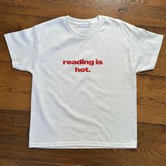 Reading Is Hot White T-Shirt Fast Shipping $25 Lowest I Can Do Custom Deadstock Hit Me With Questions Cute Swear Shirt, Shirt With Words Aesthetic, Simple Iron On Shirts, Cool Printed Shirts, Fun Baby Tees, Iconic T-shirts, Cheap Basic Tops With Embroidered Text, Reading Is Hot Shirt, Galentine Tshirt