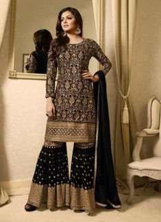 Make a cool fashion statement wearing this bollywood diva Drashti Dhami style black colored palazzo style suit. This georgette palazzo suit decorated with zari embroidery and hand work also paired with matching santoon bottom and chiffon dupatta. Georgette Jacket, Pakistani Sharara, Drashti Dhami, Abaya Style, Suits Dress