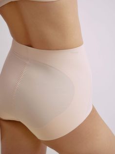 Enjoy a smooth, flattering silhouette with the Nude Shape High Waist Brief. This design offers full coverage and shapes your waist, providing a streamlined foundation for any look. Details Materials & Care Shipping & Returns • High-waist, full-coverage design features abdominal and rear panels to provided gentle tummy control and a subtle lift for the hips.• Seamless edges at the waistband and leg openings ensure a smooth, no-dig fit that stays invisible under clothing.• Made from breathable jac